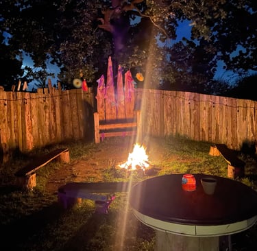 Communal fire pit area sheltered and ready for toating marshmellows