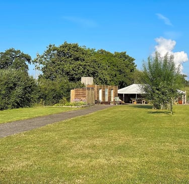 Daytime greenery looking at the showers and toilets