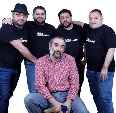 Five men wearing Boheme t-shirts and casual jeans posing together against a white background.