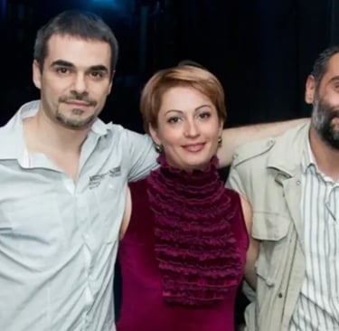 Three Armenian actors posing together against a dark background in professional casual attire.