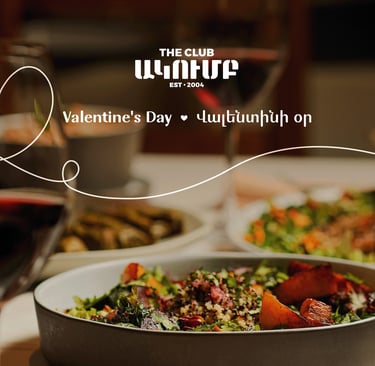 Romantic Valentine's Day dinner at The Club with gourmet salads and red wine.