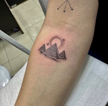 Sun and moon tattoo in fine line on forearm — Hurghada Tattoo Studio