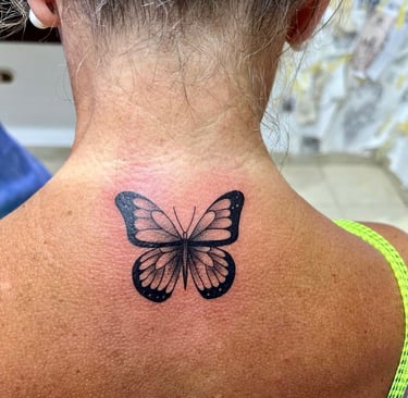Fine line butterfly tattoo on neck — Hurghada Tattoo Studio
