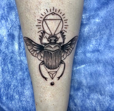 Scarab tattoo in black and grey on foot — Hurghada Tattoo Studio