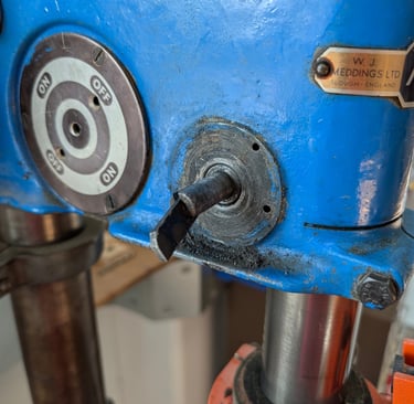 The image shows the faulty area on the vintage pillar drill.