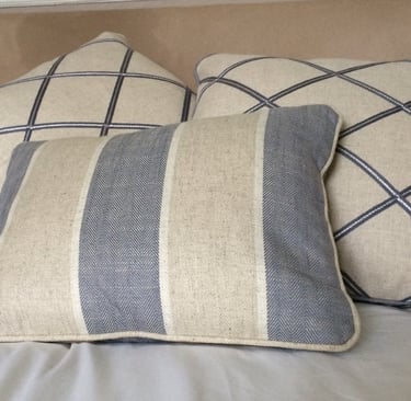 Bespoke piped cushions in blue and beige fabrics that tone beautifully