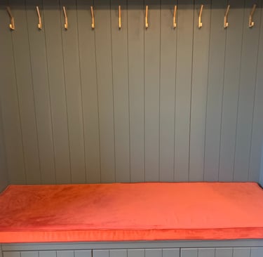 Bight orange velvet box cushion made to fit a coat stand. Plain fabric runs sideways to avoid joins