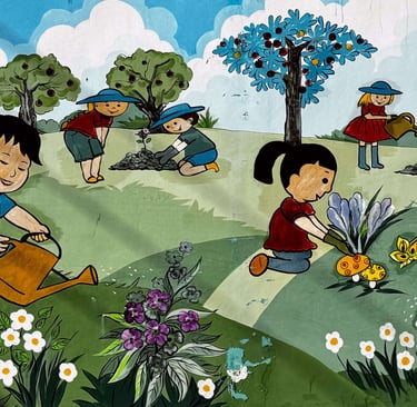 Colorful mural of children in a garden at a Vietnamese kindergarten