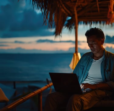 a digital nomad sitting on a couch with a laptop by the sea in Vietnam