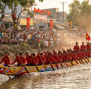 A long Khmer Ghe Ngo boat painted in bright traditional patterns races along the Maspero River durin