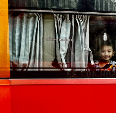 Boy in bus, Western bus station, Saigon, Vietnam