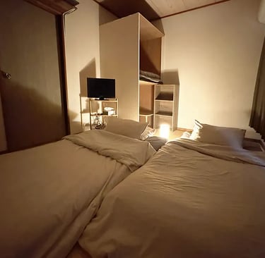 Traditional Japanese-style twin room at Nakadaya Asakusa with tatami mats and futons.