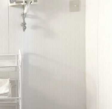 Modern and private shared shower room facilities at Ryokan Nakadaya Asakusa.