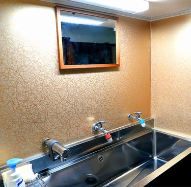 Clean and well-maintained shared vanity area at Ryokan Nakadaya Asakusa for international guests.