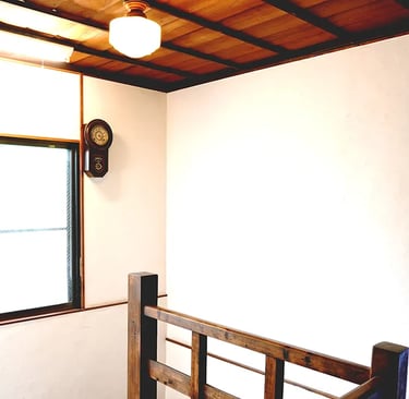 A historic wooden staircase showcasing traditional Japanese architecture at Nakadaya.