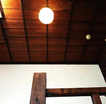 A historic wooden staircase showcasing traditional Japanese architecture at Nakadaya.