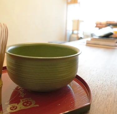 Relaxing with matcha green tea in the historic common room at Ryokan Nakadaya Asakusa.