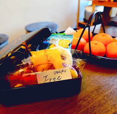 Nakadaya Asakusa: The cozy traditional Japanese common room with a warm atmosphere.