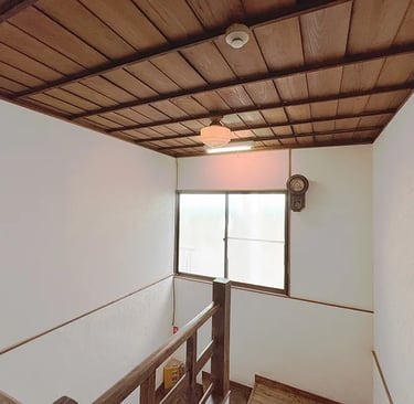 A historic wooden staircase showcasing traditional Japanese architecture at Nakadaya.