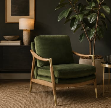Olive green velvet lounge chair with oak wood frame styled in a dark organic modern living room with