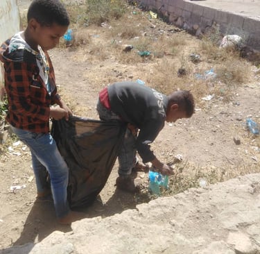 Muhamasheen boys clean up garbage