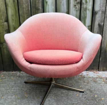 vintage Overman style egg chair with faded fabric and rusted legs