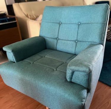 reupholstered blue swivel mcm boxy chair