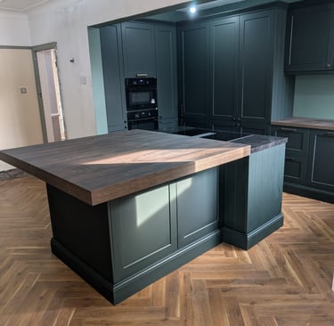 dark green with wooden tabletop kitchen