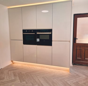 white kitchen with infit oven, with nice warm back lighting
