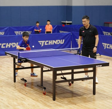 An energetic match between two Sri Lankan players in a local club, with vibrant crowd support.