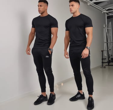 Men's matching tracksuit in deep charcoal with sleek, urban cut.