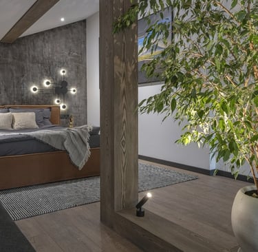 a bedroom with a bed and a couch