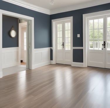 Close-up of a painter priming a smooth wall surface, highlighting attention to detail.