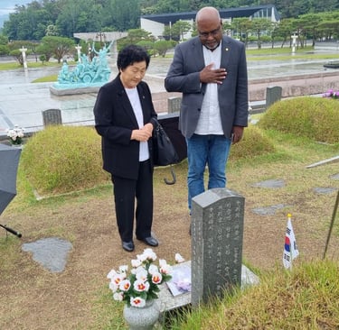 Paying respect to the boy, Moon Jaehak, with boy's mother, Kim Gil-ja