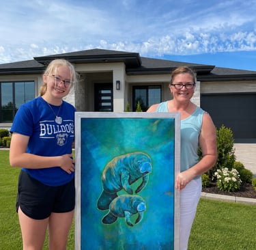 A mother manatee and her baby - Charity Bell and her adorable daughter