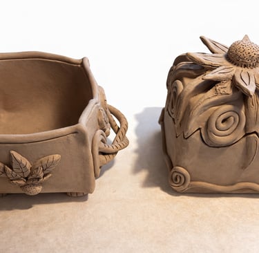 Habd-built pottery box with flower lid