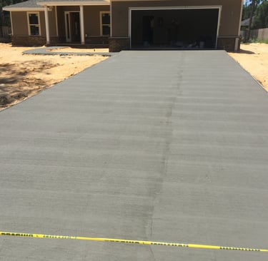 Concrete driveway installation for residential home with smooth finish concrete surface