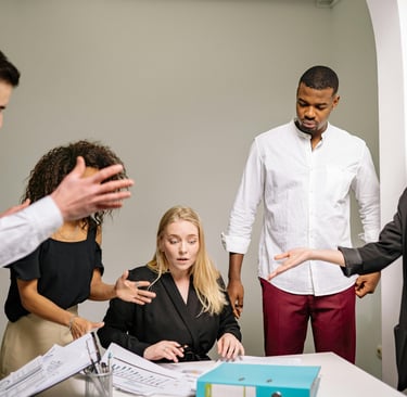A high performing team member surrounded by colleagues who need their help on the verge of a burnout