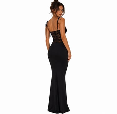 Back view of elegant black fitted maxi dress with lace waist detail and minimal evening aesthetic.