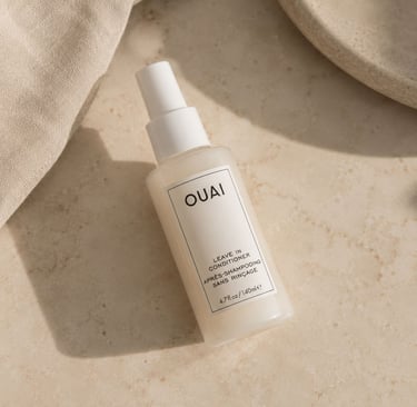 OUAI leave in conditioner bottle with neutral luxury aesthetic