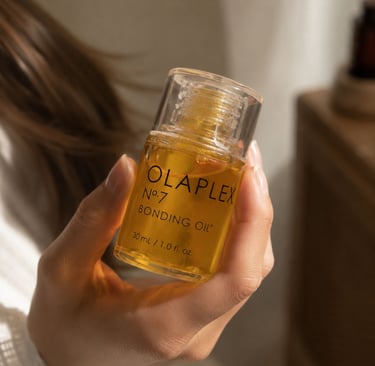 Clean girl aesthetic hair care flatlay with Olaplex bonding oil