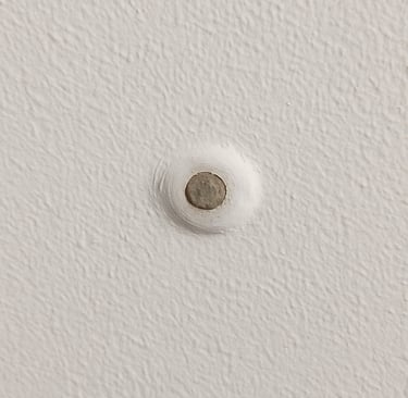 Nail pop in drywall