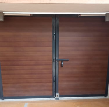 a pair of doors with a wooden door and a door with a window