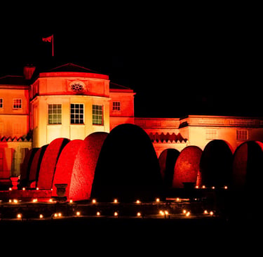 Luminate Shugborough  Hall by Night illuminated in orage light