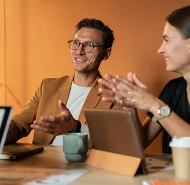 Professional business colleagues having a collaborative meeting with tablets in a modern office.