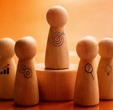 Wooden peg doll with a target symbol leading a team toward business goals and strategic objectives.