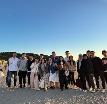 A team of coffee people in Japan beach side company trip