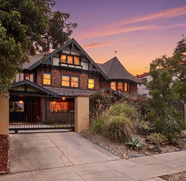 Three-story 1906 Craftsman house at 1415 South Manhattan Place in the Angelus Vista neighborhood.