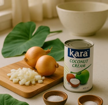 “Ingredients for Samoan Palusami (Lu‘au) including taro leaves, coconut cream, onion, and salt on a 