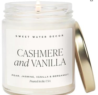 Sweet Water Decor Cashmere and Vanilla scented glass jar candle with a gold lid.